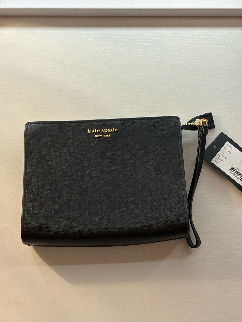 kate spade black saffiano wristlet clutch with gold logo